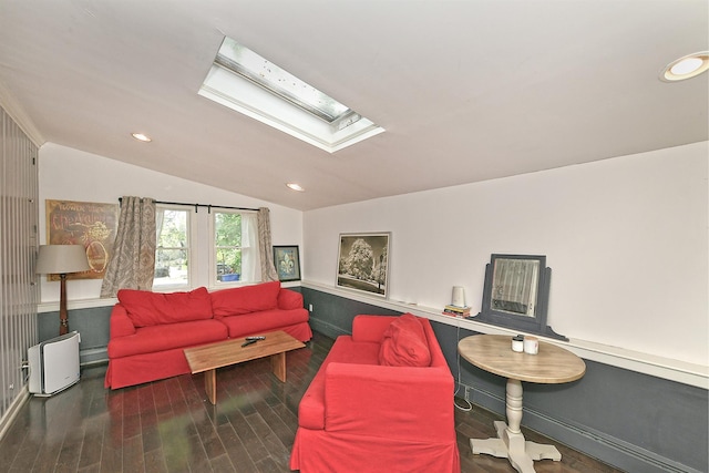 living area with a skylight, vaulted ceiling, wood finished floors, and recessed lighting