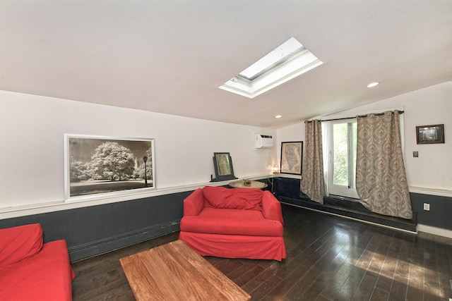 living area featuring vaulted ceiling, a skylight, wood finished floors, and a wall mounted AC