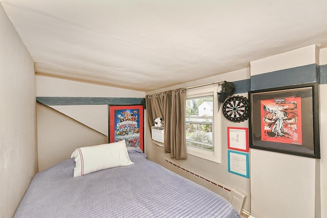 bedroom featuring a baseboard radiator and vaulted ceiling