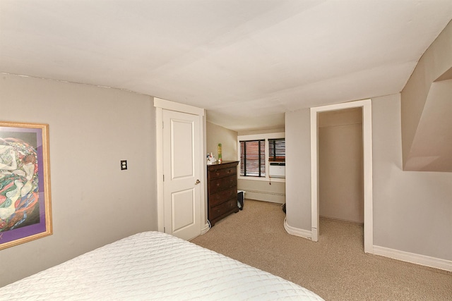 bedroom featuring light colored carpet and baseboards