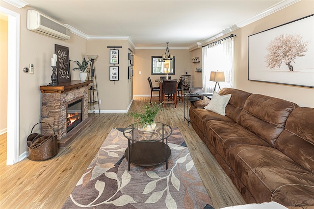 50 Louisiana Ave Unit 9R, Bronxville, NY 10708 - living room featuring a wall unit AC, wood finished floors, crown molding, baseboards, and a fireplace