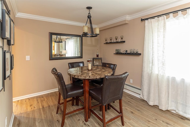 50 Louisiana Ave Unit 9R, Bronxville, NY 10708 - dining space with light wood-style floors, baseboard heating, a chandelier, crown molding, and baseboards
