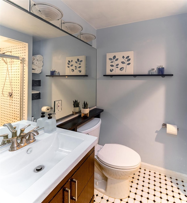 50 Louisiana Ave Unit 9R, Bronxville, NY 10708 - bathroom with toilet, a shower, vanity, and baseboards