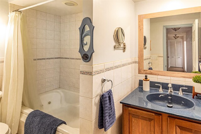 50 Louisiana Ave Unit 9R, Bronxville, NY 10708 - full bathroom featuring shower / bathtub combination with curtain, vanity, a wainscoted wall, and toilet