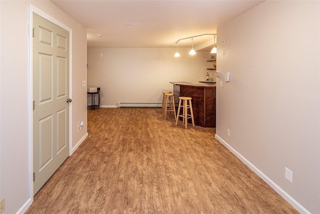 50 Louisiana Ave Unit 9R, Bronxville, NY 10708 - hallway with a baseboard radiator, wood finished floors, and baseboards
