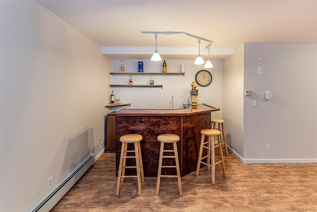 50 Louisiana Ave Unit 9R, Bronxville, NY 10708 - indoor bar featuring baseboard heating, baseboards, and wood finished floors