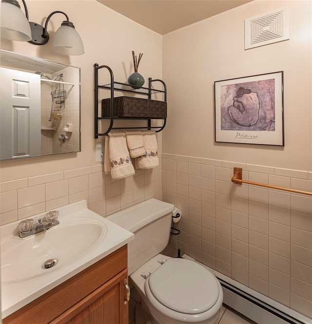 50 Louisiana Ave Unit 9R, Bronxville, NY 10708 - full bathroom featuring tile walls, baseboard heating, a shower, vanity, and toilet
