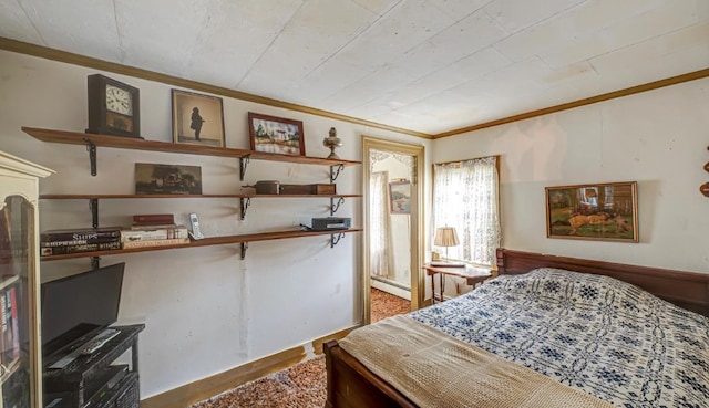 bedroom with crown molding and baseboard heating
