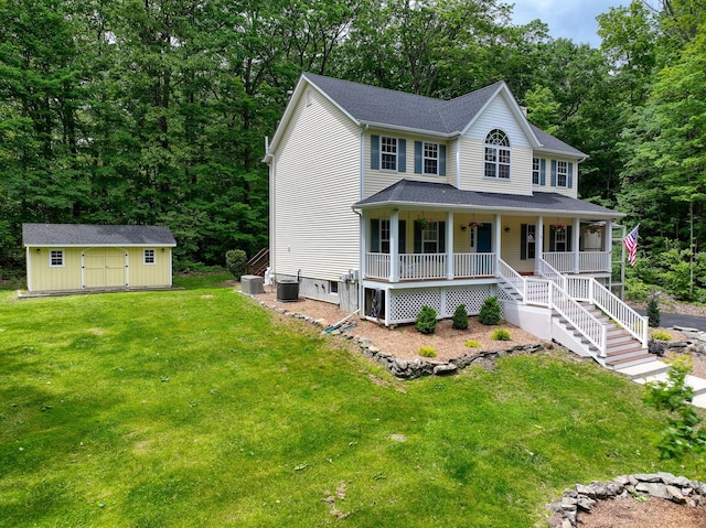 293 S Centerville Rd, Middletown, NY 10940 - view of front of property with a porch, cooling unit, a front lawn, and view of wooded area