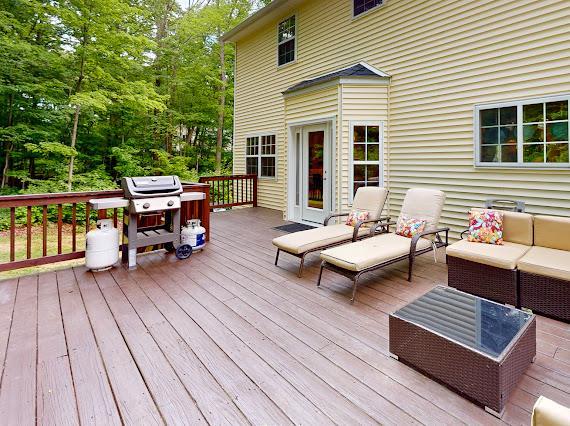 293 S Centerville Rd, Middletown, NY 10940 - deck with outdoor lounge area, a grill, and view of wooded area