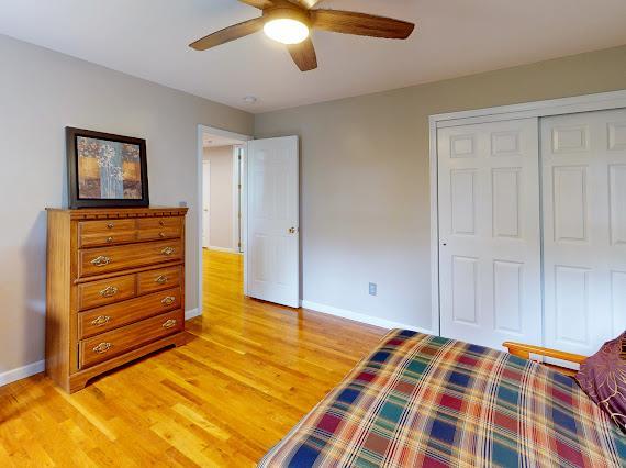 293 S Centerville Rd, Middletown, NY 10940 - bedroom featuring baseboards, a closet, and light wood-style flooring