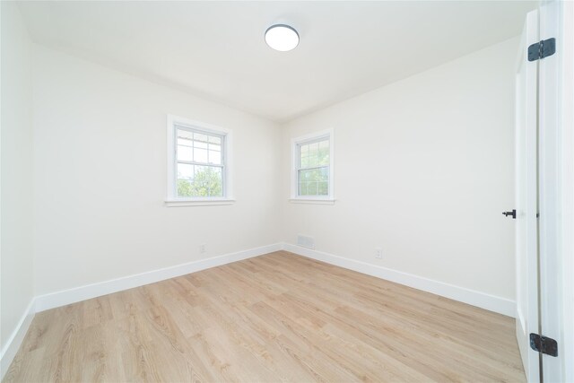 2001 Wellington Ct, Westbury, NY 11590 - spare room featuring light wood finished floors and baseboards