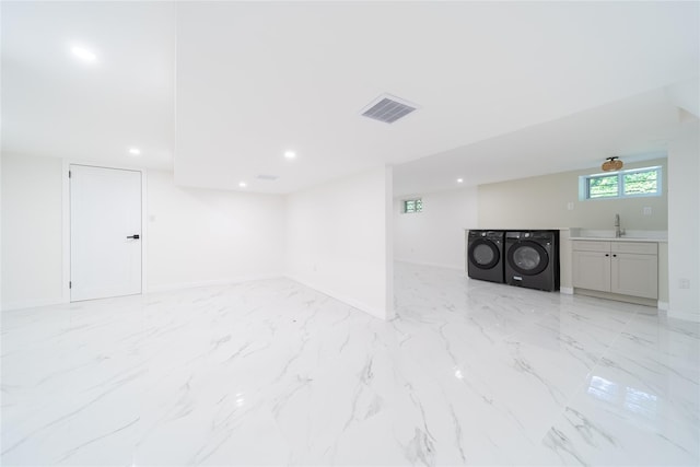 2001 Wellington Ct, Westbury, NY 11590 - basement featuring independent washer and dryer, light marble finish floors, a sink, baseboards, and recessed lighting