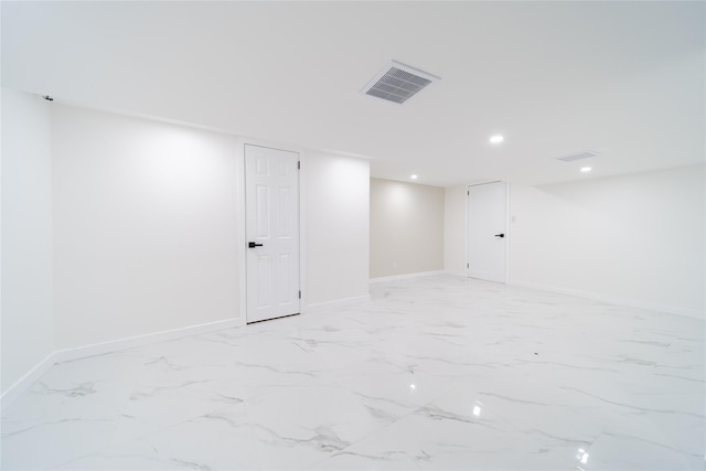 2001 Wellington Ct, Westbury, NY 11590 - finished basement featuring recessed lighting, baseboards, and light marble finish flooring