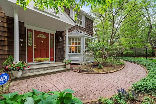 doorway to property with fence