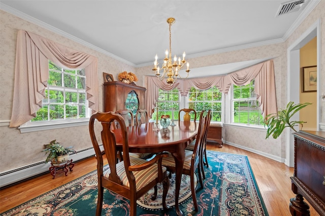 dining room featuring wallpapered walls, a chandelier, light wood-type flooring, ornamental molding, and baseboards