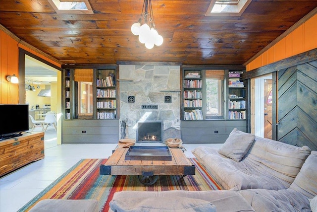 62 Stag Forest Rd, Forestburgh, NY 12777 - living room with wooden ceiling, wooden walls, a stone fireplace, a skylight, and lofted ceiling