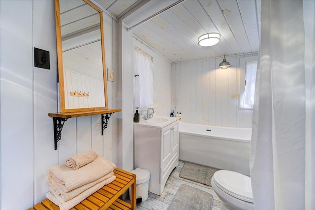 62 Stag Forest Rd, Forestburgh, NY 12777 - full bathroom with toilet, vanity, wood walls, and wood ceiling