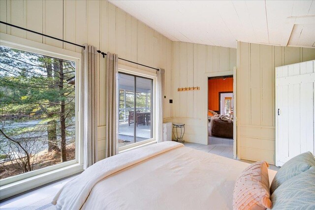 62 Stag Forest Rd, Forestburgh, NY 12777 - bedroom featuring lofted ceiling, access to exterior, and wooden walls
