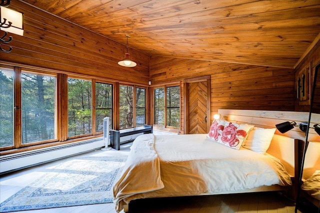 62 Stag Forest Rd, Forestburgh, NY 12777 - bedroom featuring vaulted ceiling, wooden ceiling, multiple windows, wooden walls, and a baseboard radiator