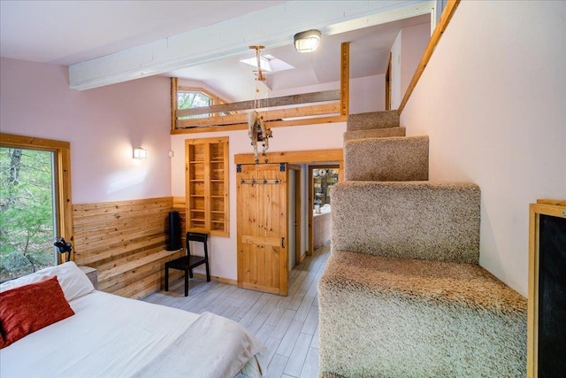62 Stag Forest Rd, Forestburgh, NY 12777 - bedroom with multiple windows, a skylight, and wood finished floors