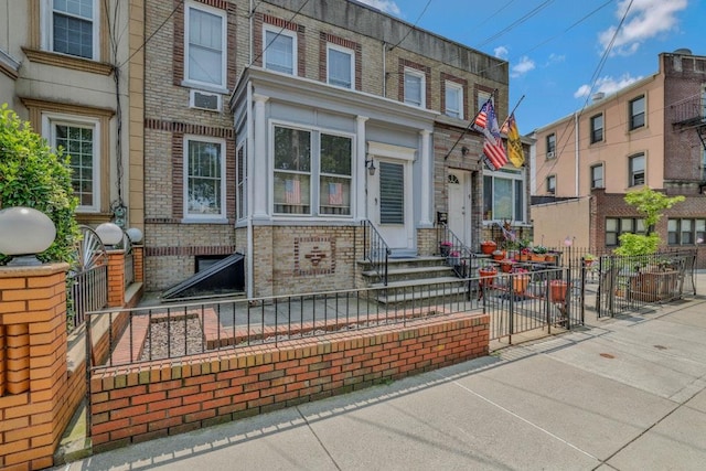 62-12 60th Dr, Maspeth, NY 11378 - back of house featuring entry steps and brick siding