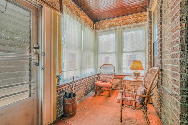 62-12 60th Dr, Maspeth, NY 11378 - sunroom / solarium featuring carpet flooring and brick wall