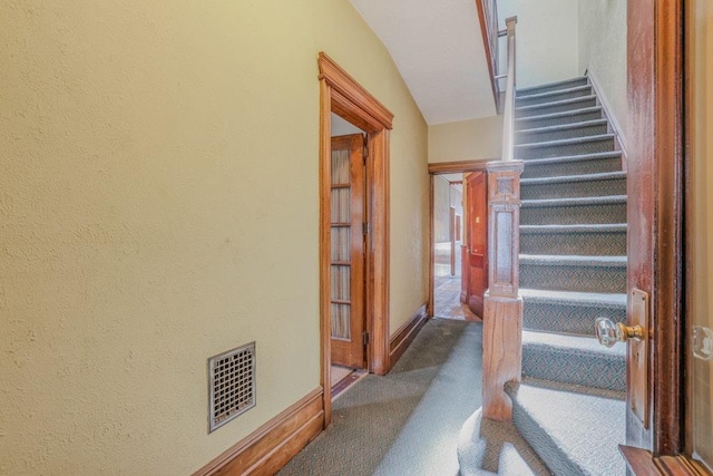 62-12 60th Dr, Maspeth, NY 11378 - stairs featuring carpet flooring, a textured wall, and baseboards