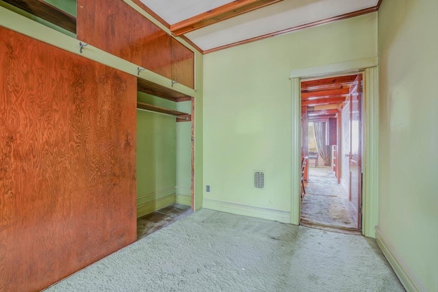 62-12 60th Dr, Maspeth, NY 11378 - unfurnished bedroom with carpet floors, baseboards, and a closet