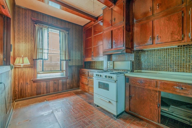62-12 60th Dr, Maspeth, NY 11378 - kitchen featuring white gas range oven, decorative backsplash, brick patterned floors, exhaust hood, and wallpapered walls