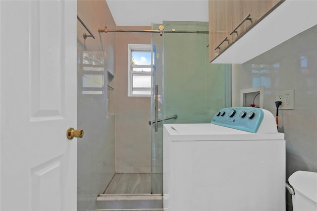 laundry room with washer / dryer and cabinet space