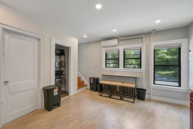 541 Broadway, Monticello, NY 12701 - living area featuring a wall mounted air conditioner, stairway, recessed lighting, and baseboards