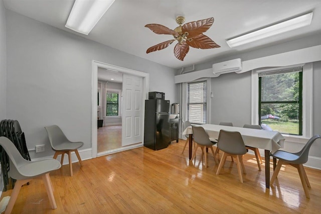 541 Broadway, Monticello, NY 12701 - dining space with a wall mounted air conditioner, light wood-style floors, plenty of natural light, and ceiling fan