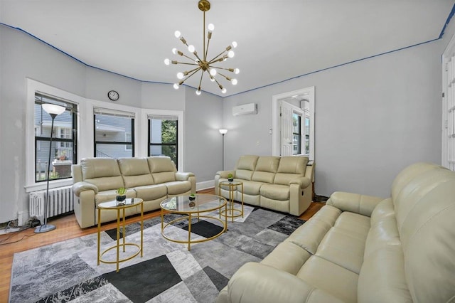 541 Broadway, Monticello, NY 12701 - living area with an AC wall unit, a chandelier, radiator, wood finished floors, and baseboards