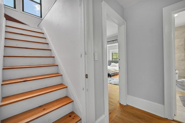 541 Broadway, Monticello, NY 12701 - stairs featuring wood finished floors and baseboards