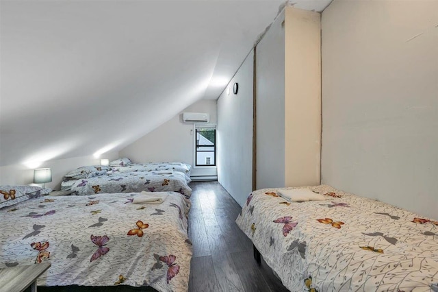 541 Broadway, Monticello, NY 12701 - bedroom with dark wood-type flooring, lofted ceiling, and a wall unit AC
