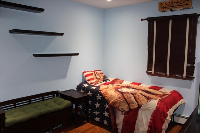 2 Burnett Ave, Bay Shore, NY 11706 - bedroom with a baseboard radiator, wood finished floors, and recessed lighting