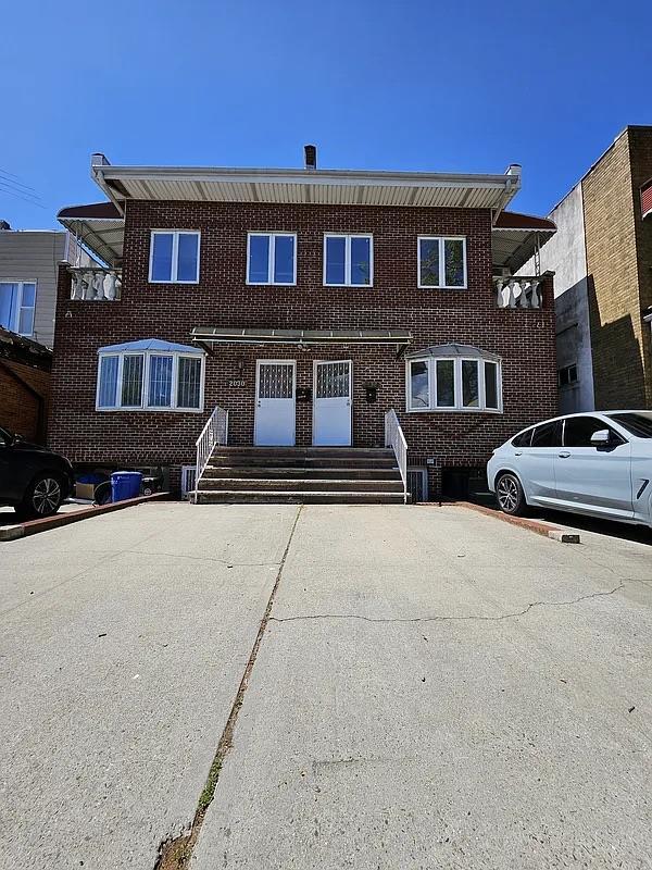 multi unit property featuring brick siding