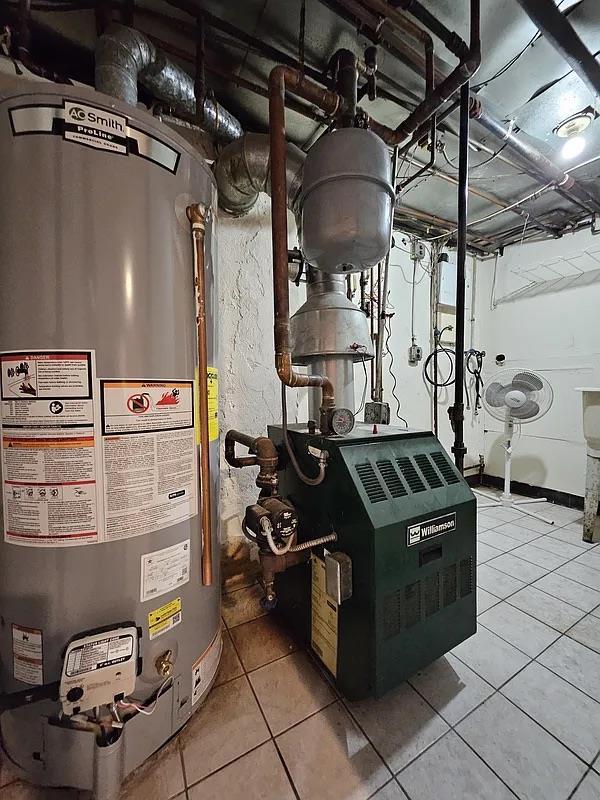 utilities featuring water heater and a heating unit