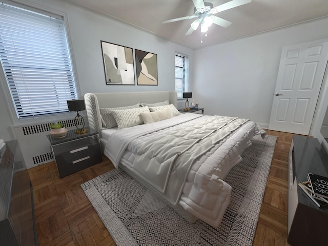 bedroom with radiator and ceiling fan
