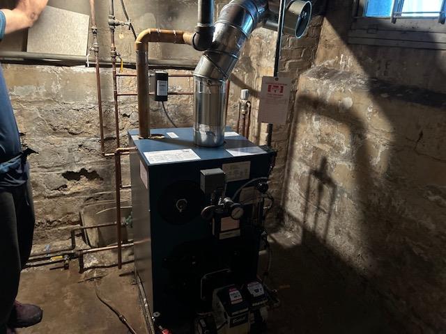 utility room with a heating unit