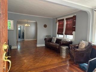 62-53 80th Rd, Glendale, NY 11385 - living area with arched walkways, a chandelier, and ornamental molding