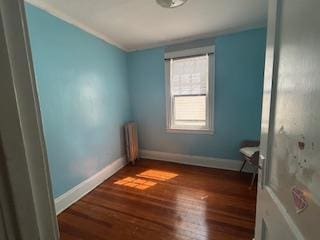 62-53 80th Rd, Glendale, NY 11385 - empty room featuring wood finished floors and baseboards