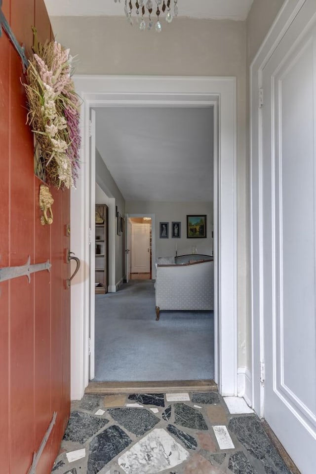 hall featuring carpet