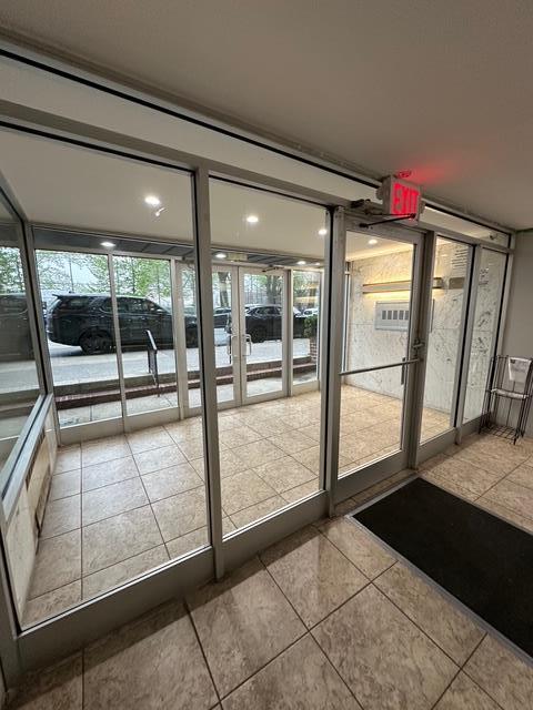 doorway featuring tile patterned flooring