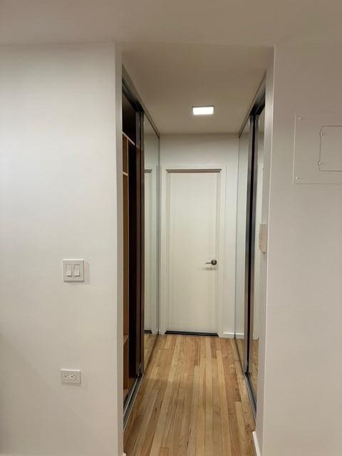 hallway featuring light wood-style flooring