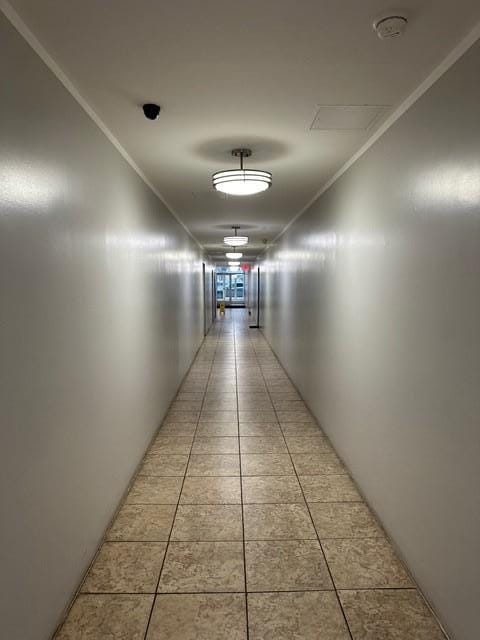 corridor with light tile patterned floors