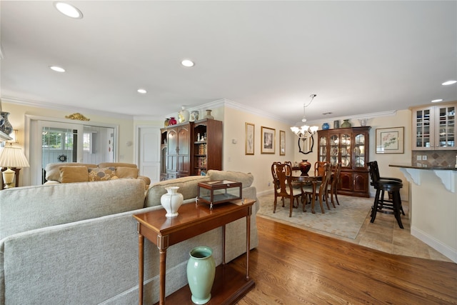 7 White Oak Ct Unit 7, Coram, NY 11727 - living room with a chandelier, recessed lighting, crown molding, baseboards, and light wood-style flooring