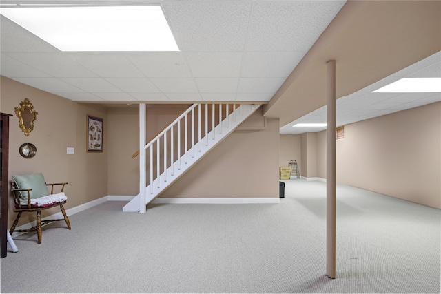 7 White Oak Ct Unit 7, Coram, NY 11727 - finished basement with carpet floors, a paneled ceiling, stairway, and baseboards
