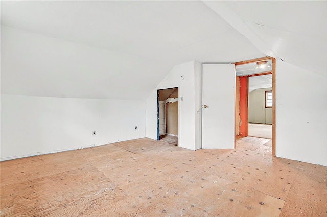 bonus room featuring lofted ceiling